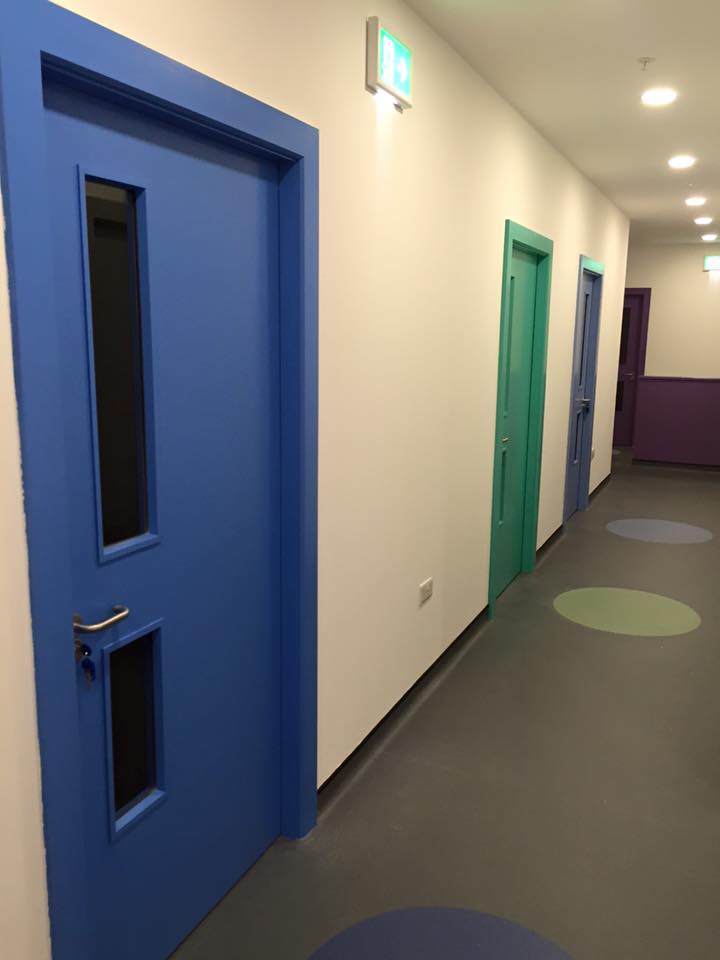 Green door at the clinic entrance